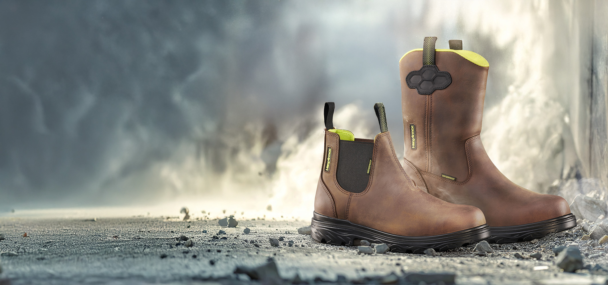 Xbuilt saftey footwear sitting on cement at a construction site