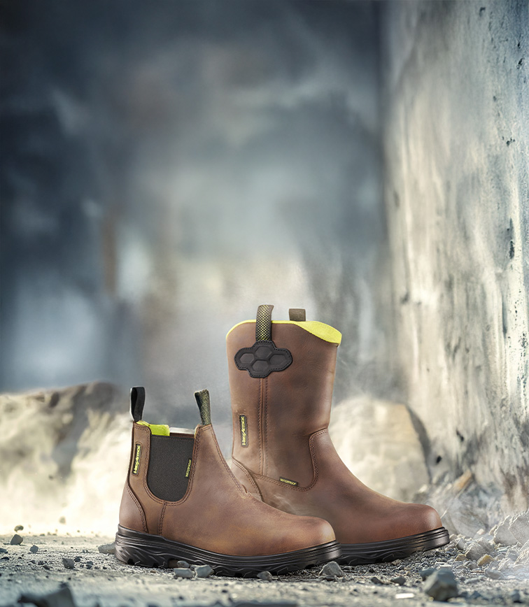 Xbuilt saftey footwear sitting on cement at a construction site