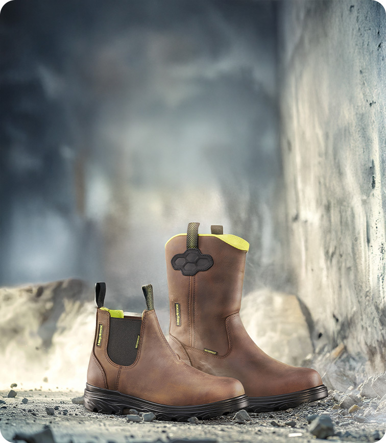 Xbuilt safety footwear sitting on cement at a construction site